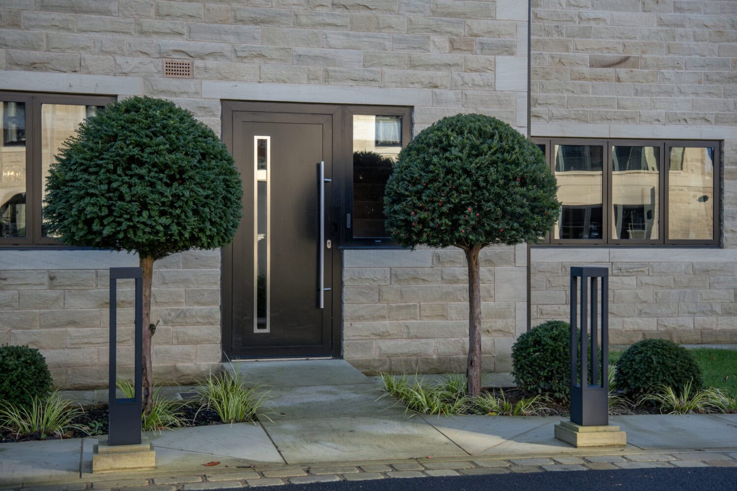 Modern steel look bifold doors with sleek design and secure locking system, enhancing the aesthetic and functionality of your home entrance.