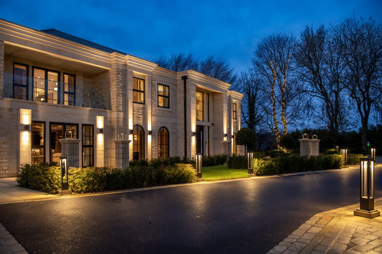 Modern steel look bifold doors installed in a luxury home, showcasing sleek design and large glass panels that enhance natural light and outdoor views.
