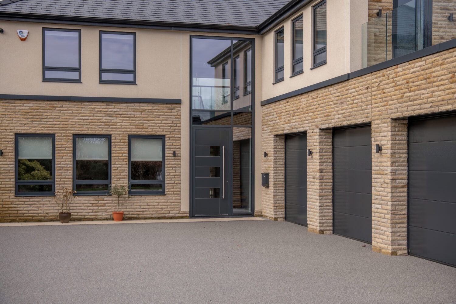 Contemporary bi-folding doors at Chapel Grove property, enhancing natural light and outdoor views with sleek design and high-quality materials.