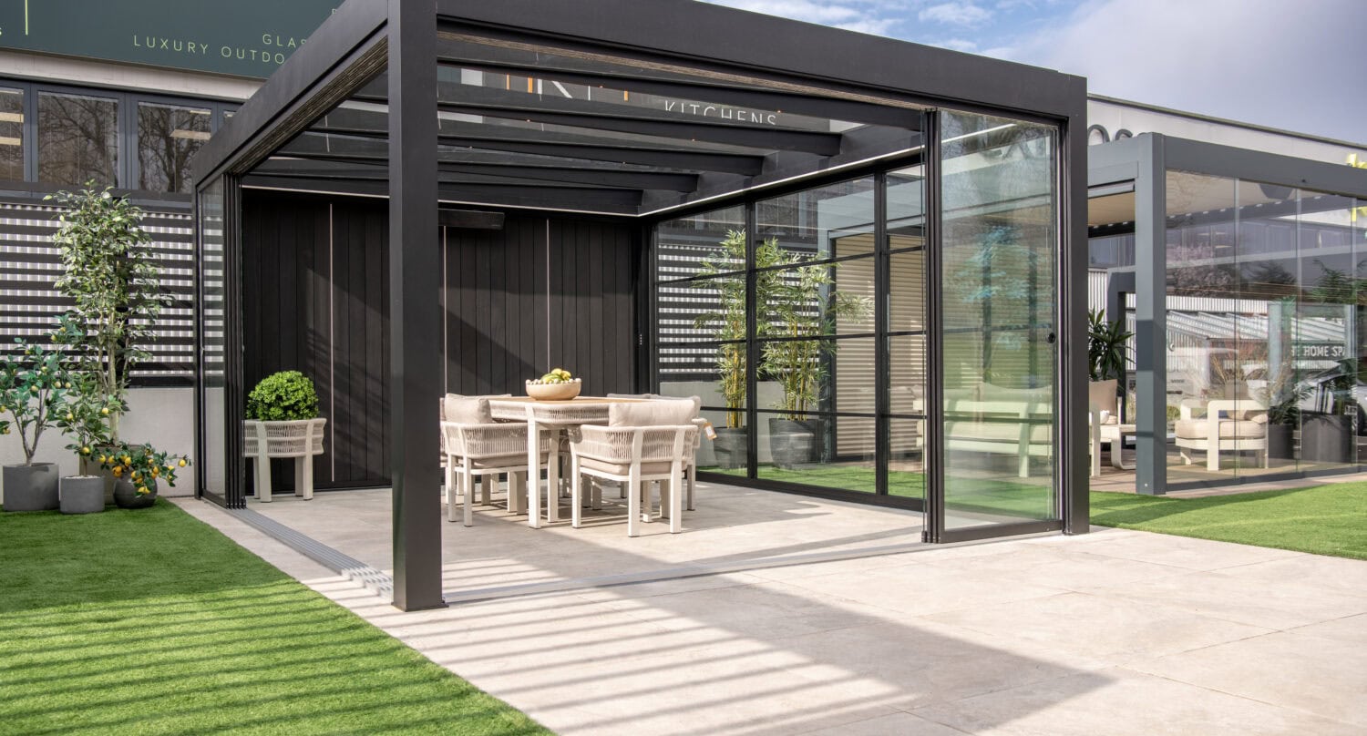 Elegant outdoor dining area featuring bi-fold doors that seamlessly connect indoor and outdoor living spaces.