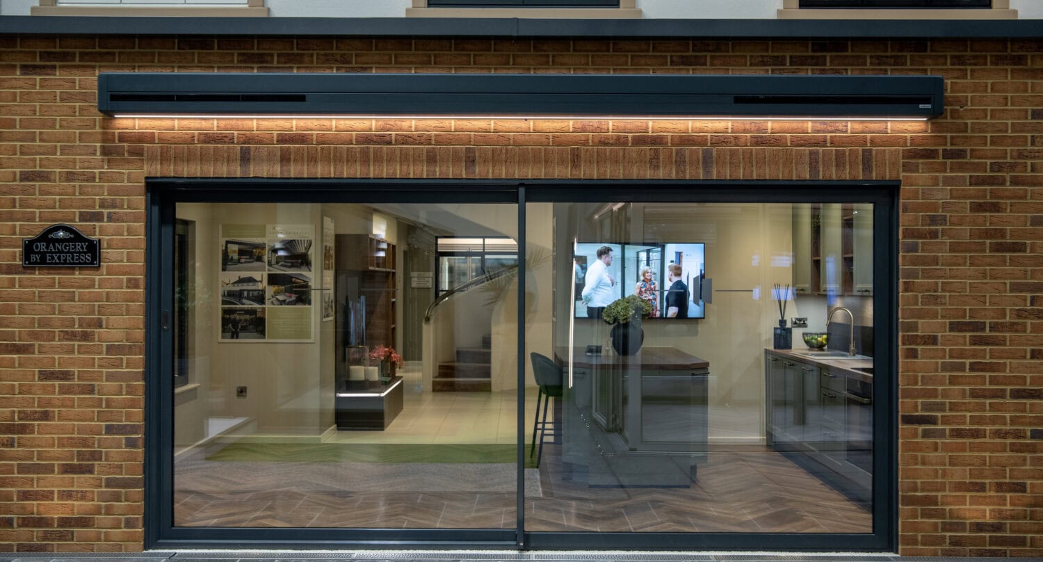 High-quality bi-fold patio doors opening to outdoor space, enhancing modern home aesthetics and functionality. Perfect for seamless indoor-outdoor living and entertaining.