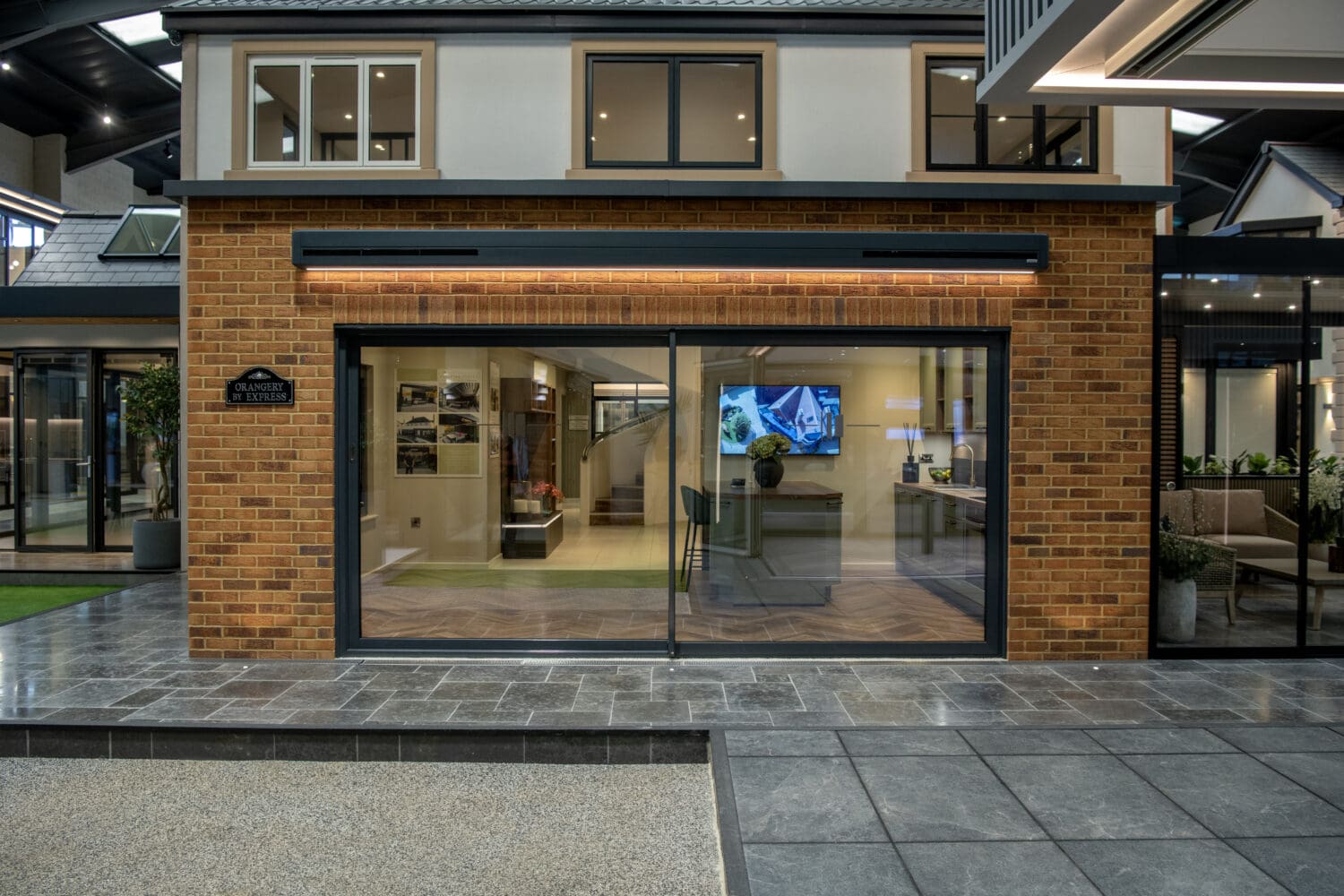 Elegant bi-folding doors opening to a modern Leeds showroom, showcasing high-quality aluminium folding doors that enhance natural light and indoor-outdoor living.
