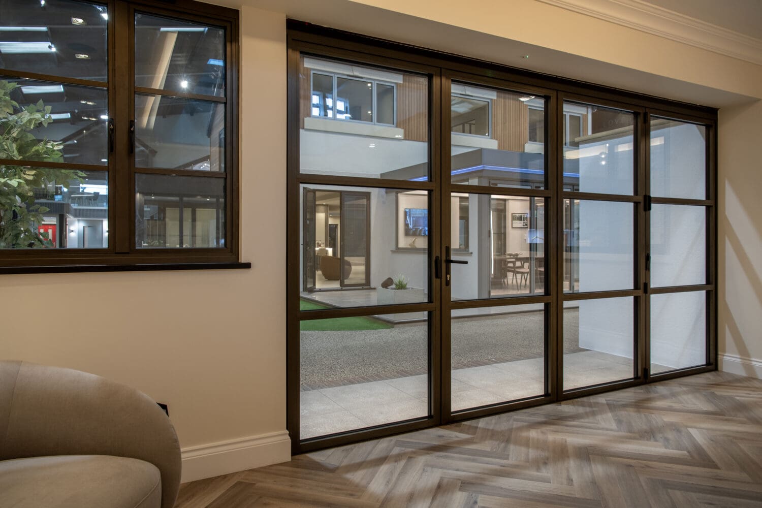 Bi-Folding Doors in Leeds showroom, showcasing modern design and high-quality craftsmanship. Perfect for enhancing indoor-outdoor living spaces with stylish, functional bi-folding door solutions.
