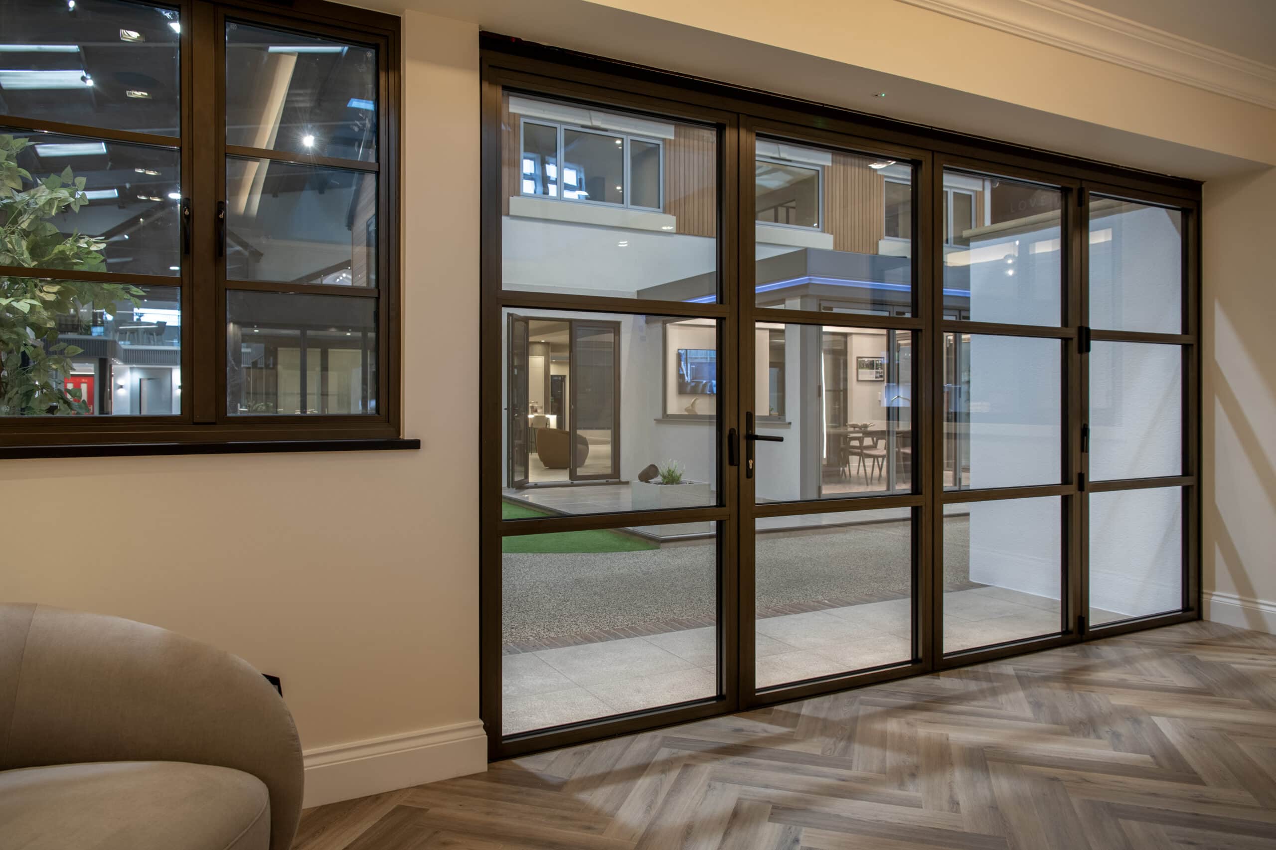 Bi-Folding Doors in Leeds showroom, showcasing modern design and high-quality craftsmanship. Perfect for enhancing indoor-outdoor living spaces with stylish, functional bi-folding door solutions.