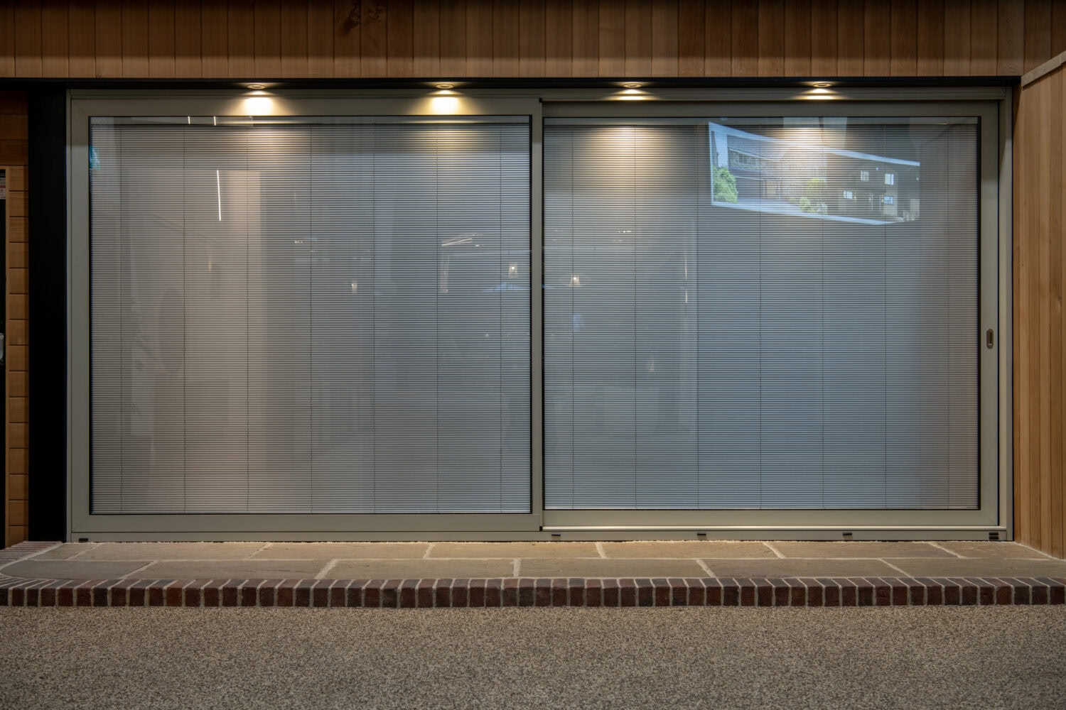 Modern sliding bi-fold doors installed in a Leeds showroom, showcasing sleek glass panels and contemporary design, perfect for enhancing commercial and retail spaces.
