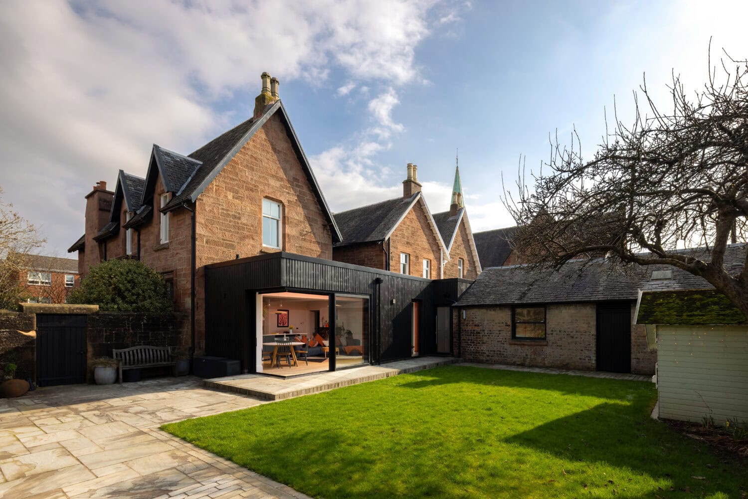 High-quality bi-folding doors installed in a historic property on Main Street, Uddingston, showcasing seamless indoor-outdoor living solutions.