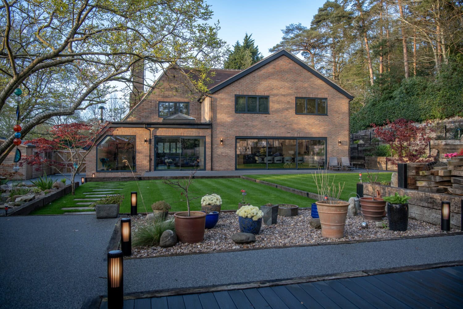 Elegant bi-folding doors opening to a landscaped garden.