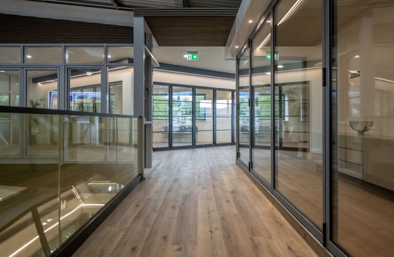 Modern interior of the new Express Bi-Folding Doors showroom in Milton Keynes, showcasing sleek glass bi-fold doors and contemporary design.