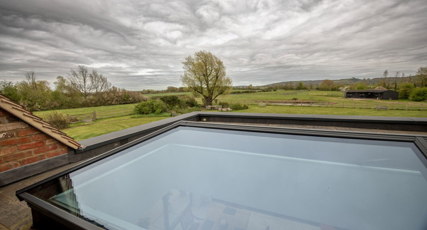 High-quality bi-folding doors installed at Manor House Farm, Buckinghamshire, offering seamless indoor-outdoor living and enhanced natural light.