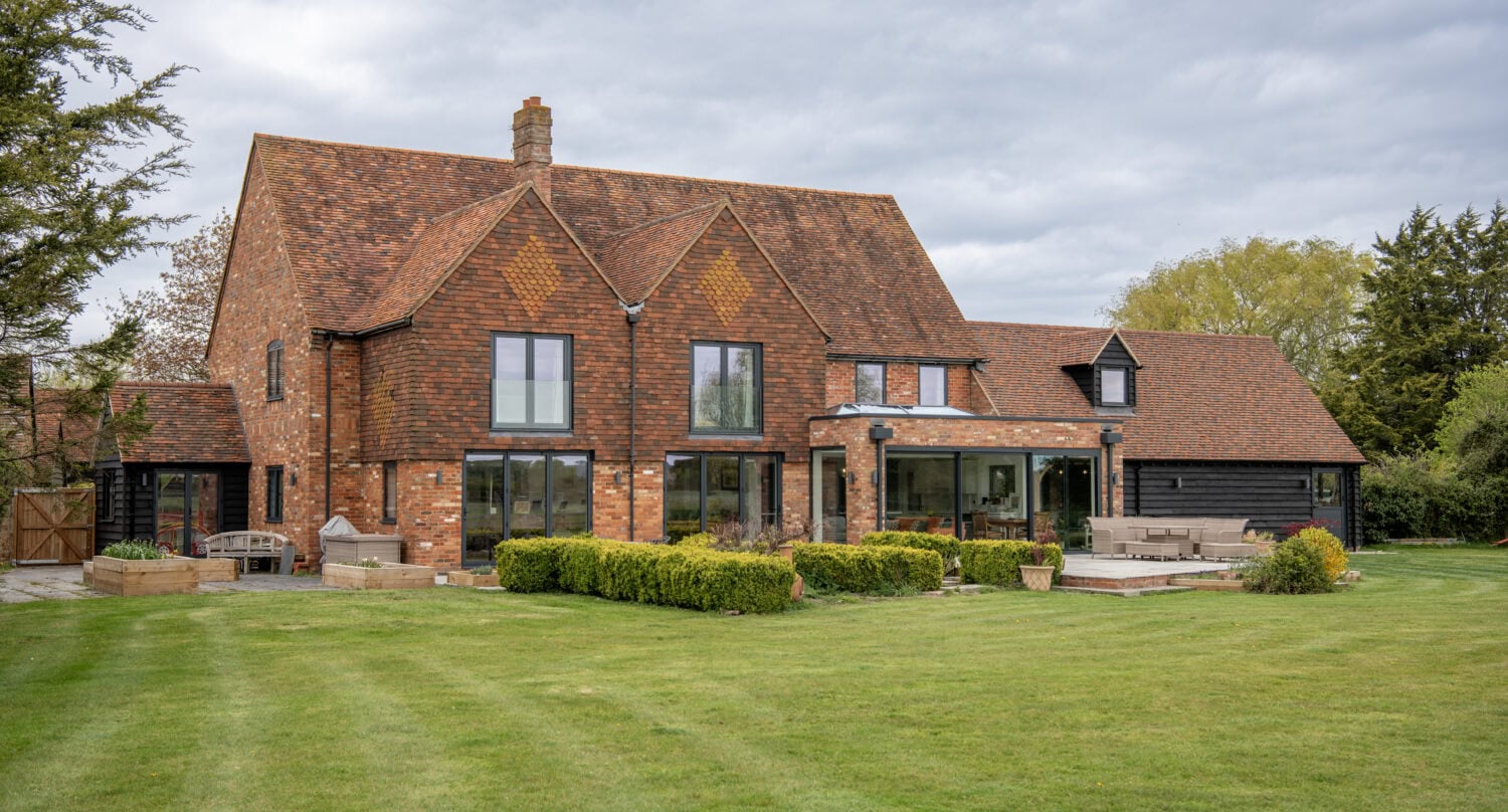 Bi-folding doors opening to a lush garden in a contemporary home.