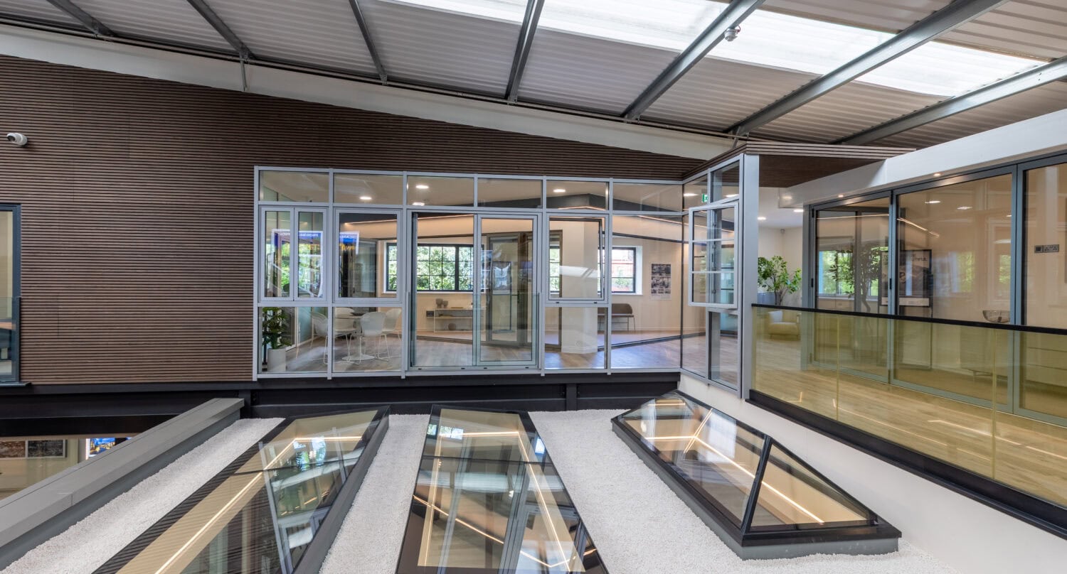 High-quality aluminium bi-folding doors installed at Milton Keynes showroom, offering seamless indoor-outdoor transition and modern design for homes and commercial spaces.