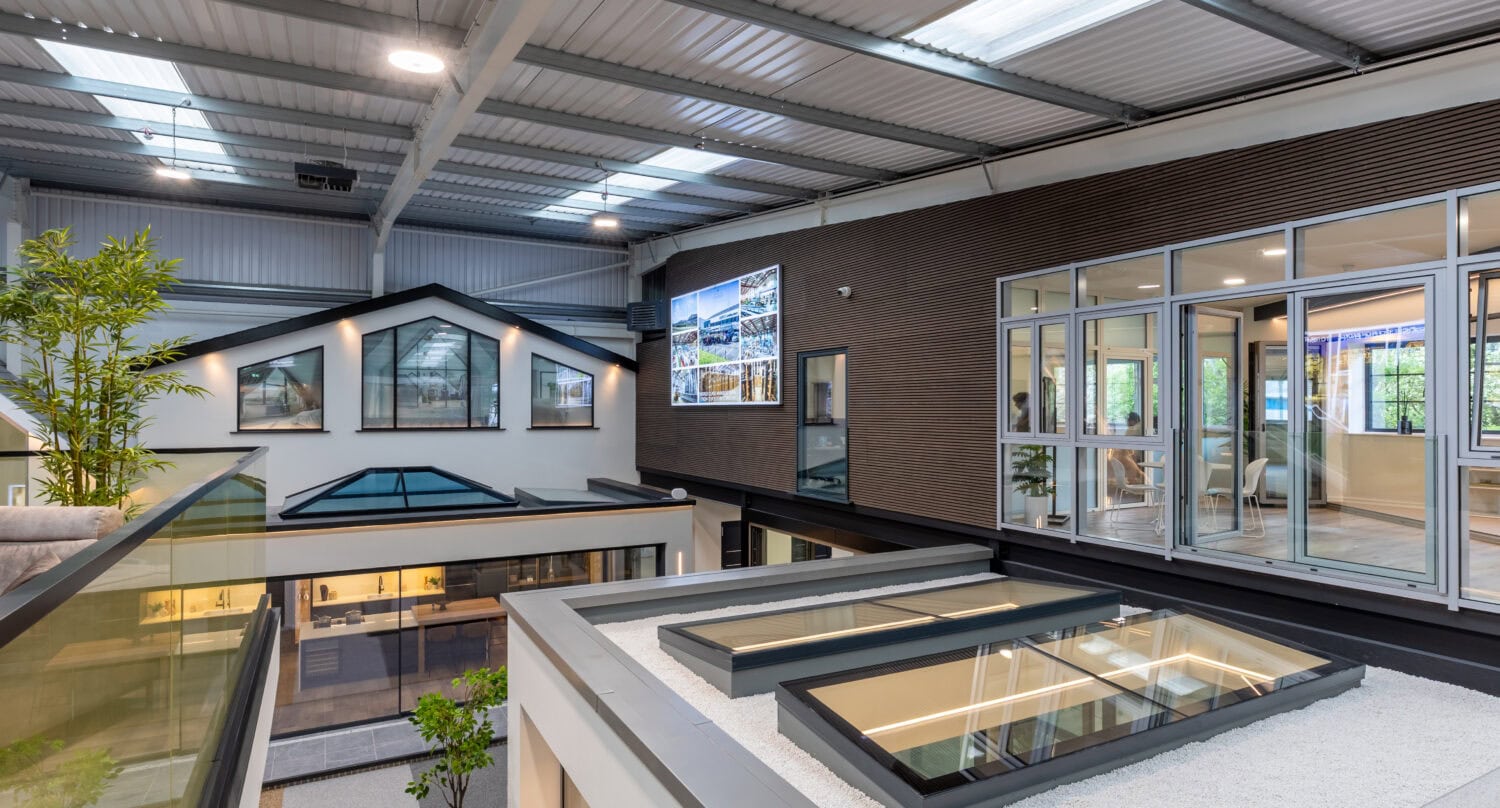 Modern Milton Keynes showroom featuring large bi-folding doors, showcasing high-quality aluminium folding doors and spacious indoor-outdoor living solutions.