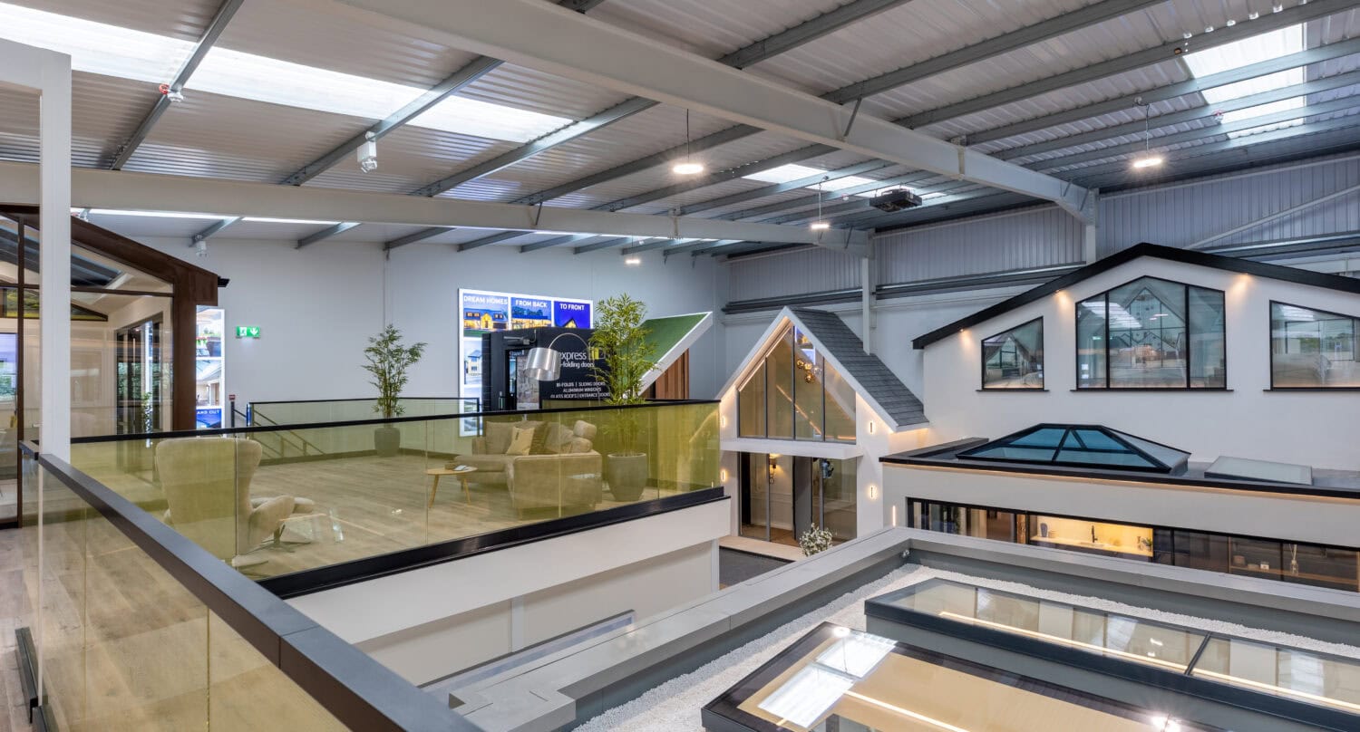 High-quality aluminium bi-folding doors installed in Milton Keynes showroom, offering seamless indoor-outdoor living solutions with modern design and excellent insulation.