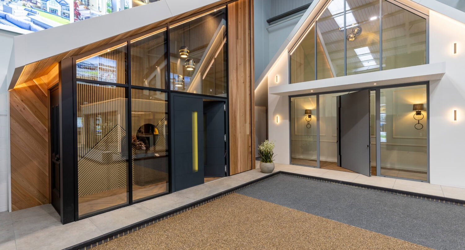 High-quality aluminium bi-folding doors at Milton Keynes showroom, offering seamless indoor-outdoor living solutions with modern design and superior insulation.