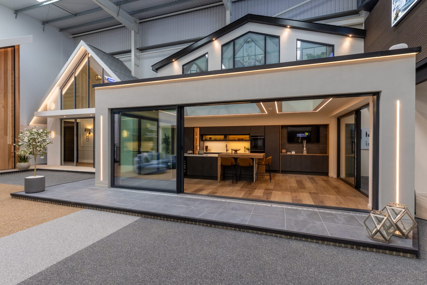 High-quality aluminium bi-folding doors installed at the Milton Keynes showroom, showcasing modern design and seamless indoor-outdoor transition for stylish home improvements.