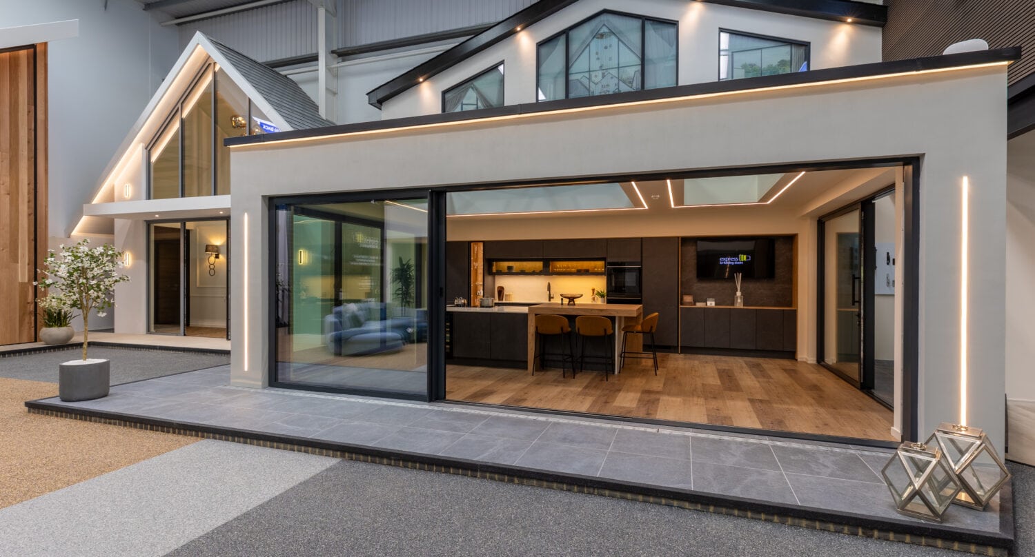 High-quality aluminium bi-folding doors installed at the Milton Keynes showroom, showcasing modern design and seamless indoor-outdoor transition for stylish home improvements.