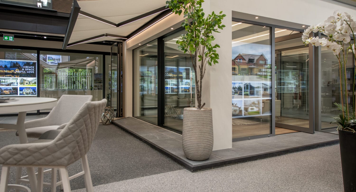 Modern bi-folding doors at Milton Keynes showroom, showcasing seamless indoor-outdoor transition and contemporary design.