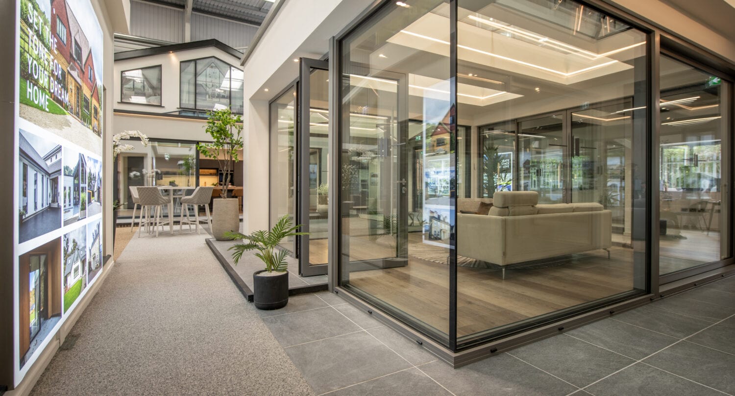 Modern bi-folding doors at Milton Keynes showroom, showcasing seamless indoor-outdoor transition and contemporary design.
