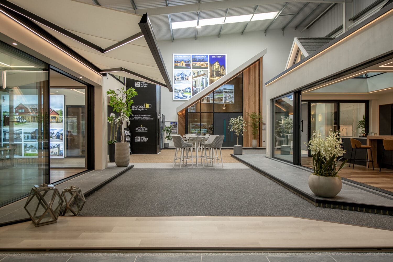 Showroom displaying modern bi-folding doors with large glass panels and sleek frames, showcasing the variety of options available at Express Bi-Folds in Milton Keynes.