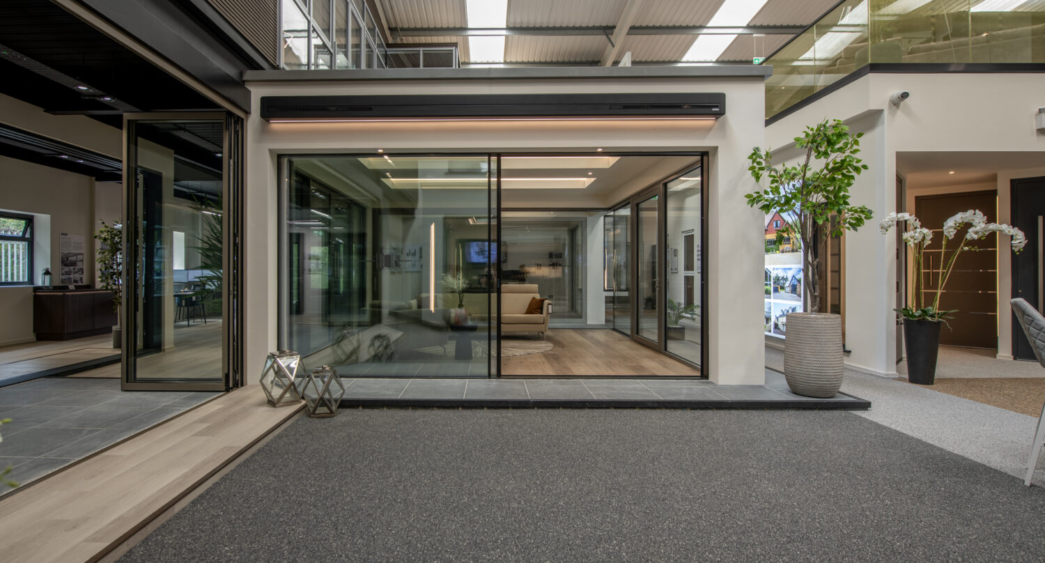 Contemporary bi-folding doors at Milton Keynes showroom, showcasing sleek design and large glass panels for indoor-outdoor living.