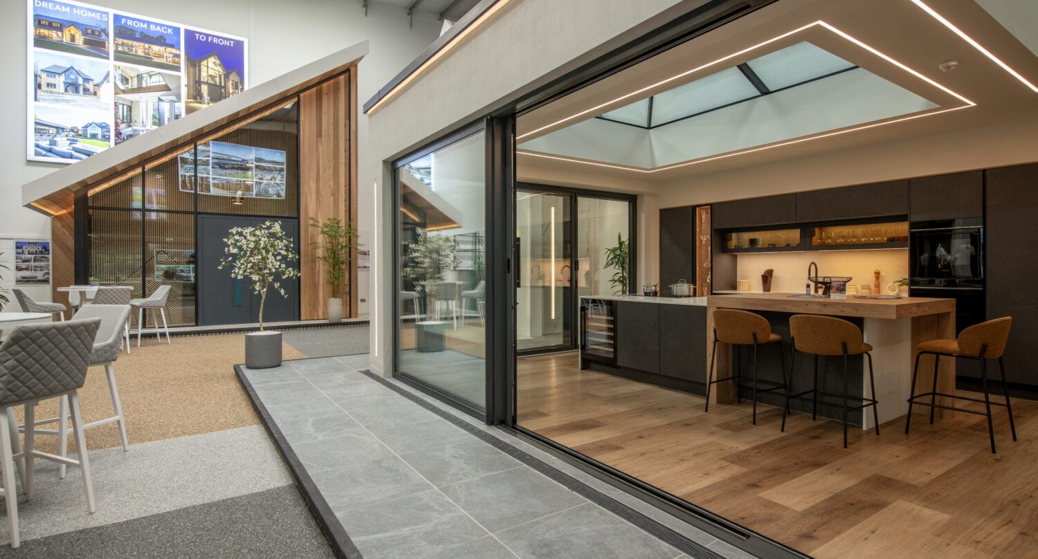 Modern bi-folding doors at Milton Keynes showroom, showcasing seamless indoor-outdoor transition and contemporary design.