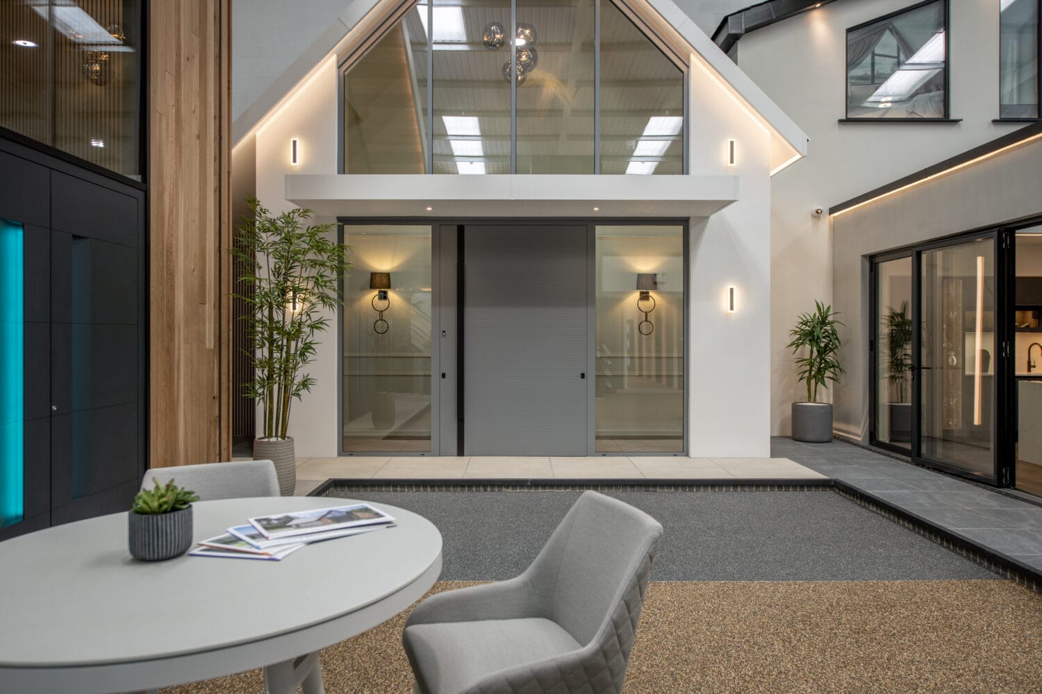 Modern Milton Keynes showroom featuring large bi-folding doors, stylish interior, and contemporary decor, showcasing high-quality folding door solutions.