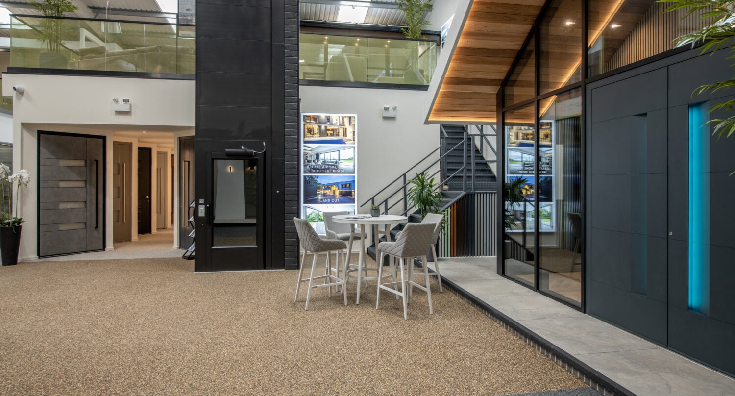 Modern Milton Keynes showroom featuring large bi-folding doors, interior seating area, and contemporary design elements.