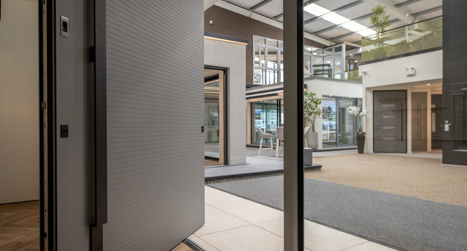 Modern Milton Keynes showroom featuring large bi-folding doors opening to a spacious interior with natural light and contemporary design.