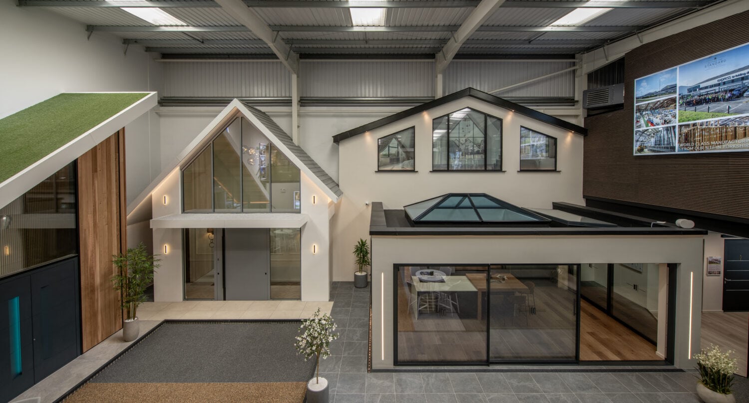 Showroom interior featuring a variety of bi-folding doors and glass extensions at Express Bi-Folds in Milton Keynes.