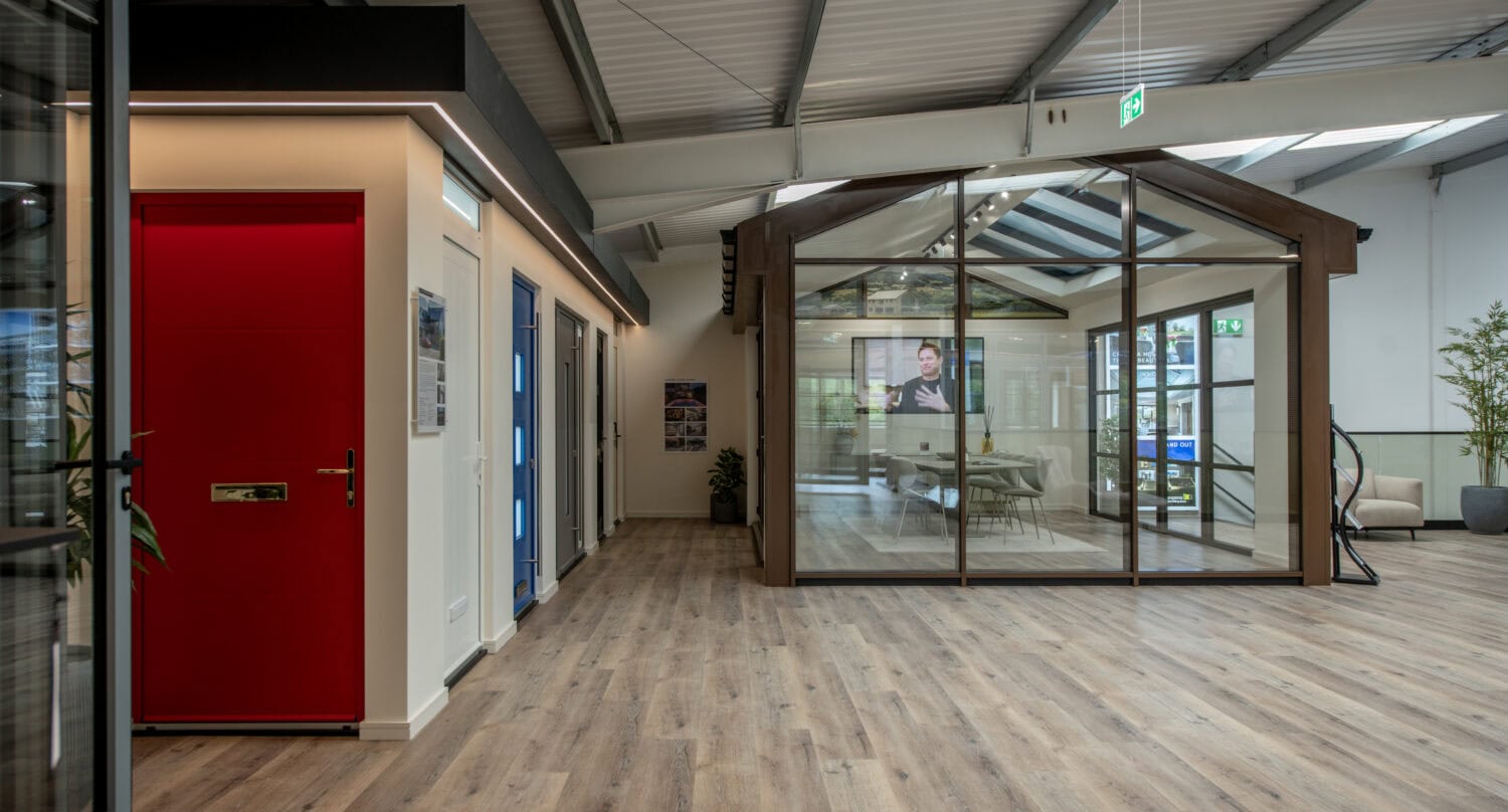 Showroom interior featuring a glass bi-folding door and modern design elements at Express Bi-Folds.