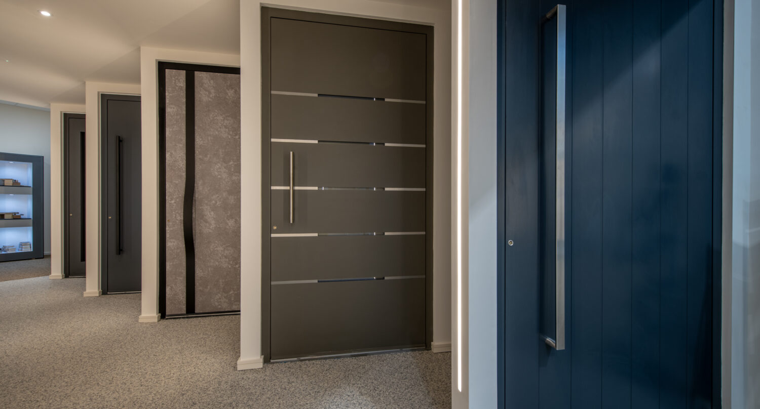 Modern bi-folding doors displayed in Milton Keynes showroom, showcasing sleek design and high-quality craftsmanship for stylish home improvements.